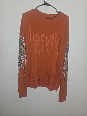 Orange Graphic Long-Sleeve Sweatshirt with Sleeve Skull Art